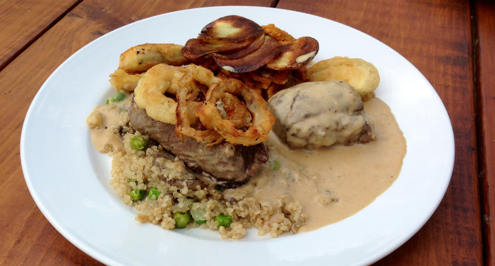 Loin of Venison in Smitane Sauce with Onion Rings